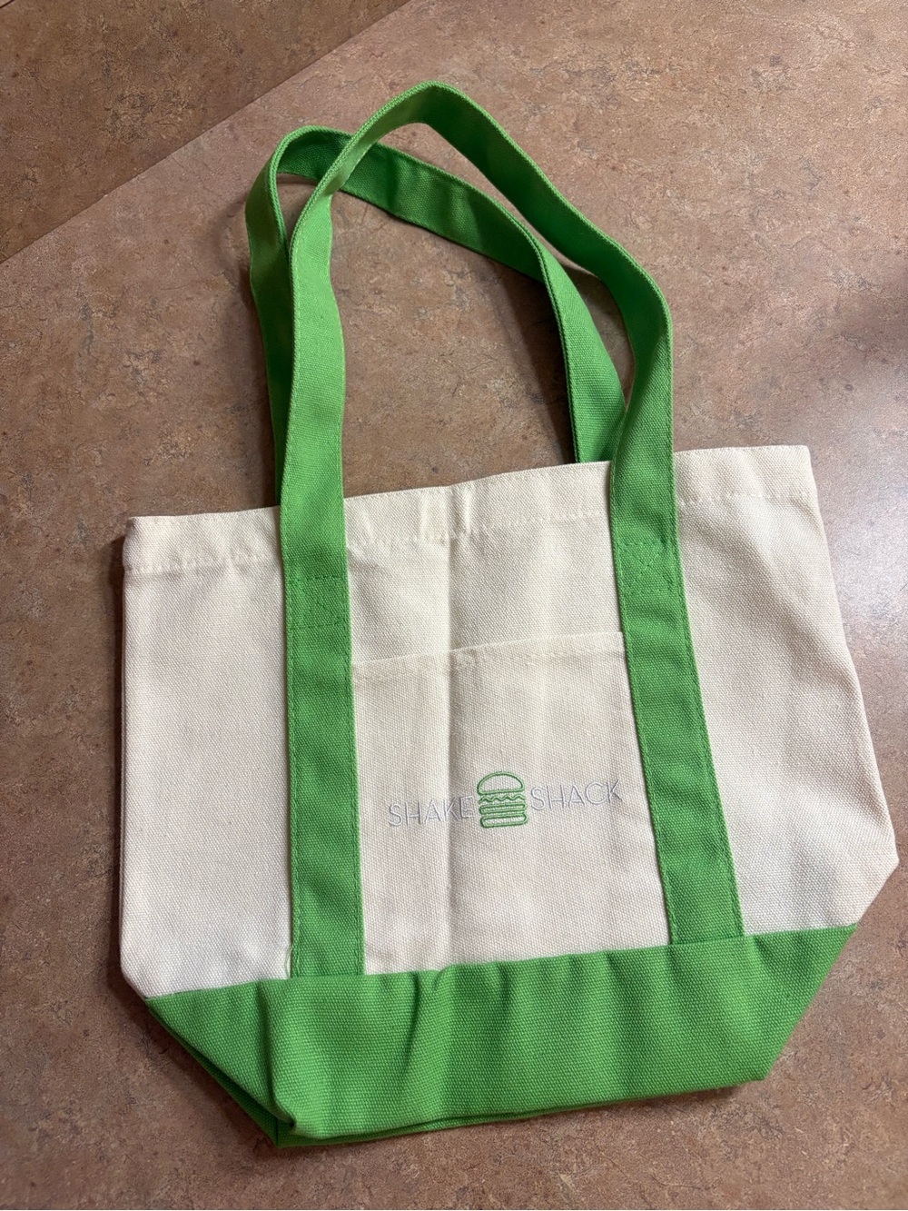 Shake Shack branded small canvas tote in cream with green trim